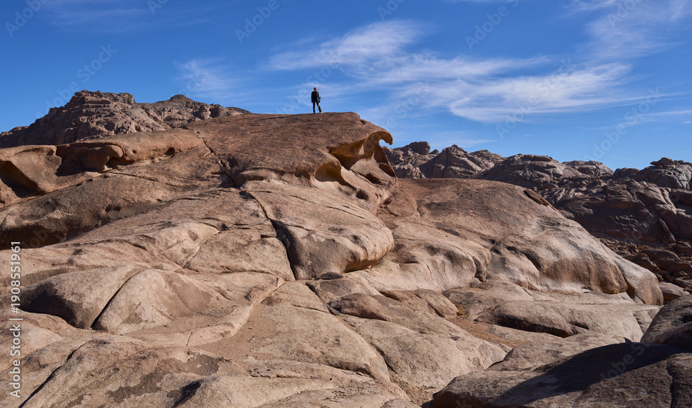 Αυτοκόλλητο Mountain landscape with female tourist posing in a summit in the national park Saint Catherine Protectorate, Sinai’s highlands in Egypt