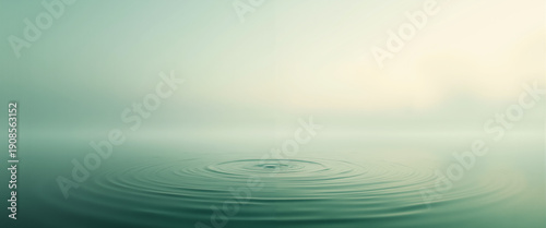 Calm water surface with ripples and mist at dawn - Concept of Magic mist over emerald lake at dawn  
