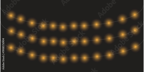 Blurry string of golden lights on a dark background
