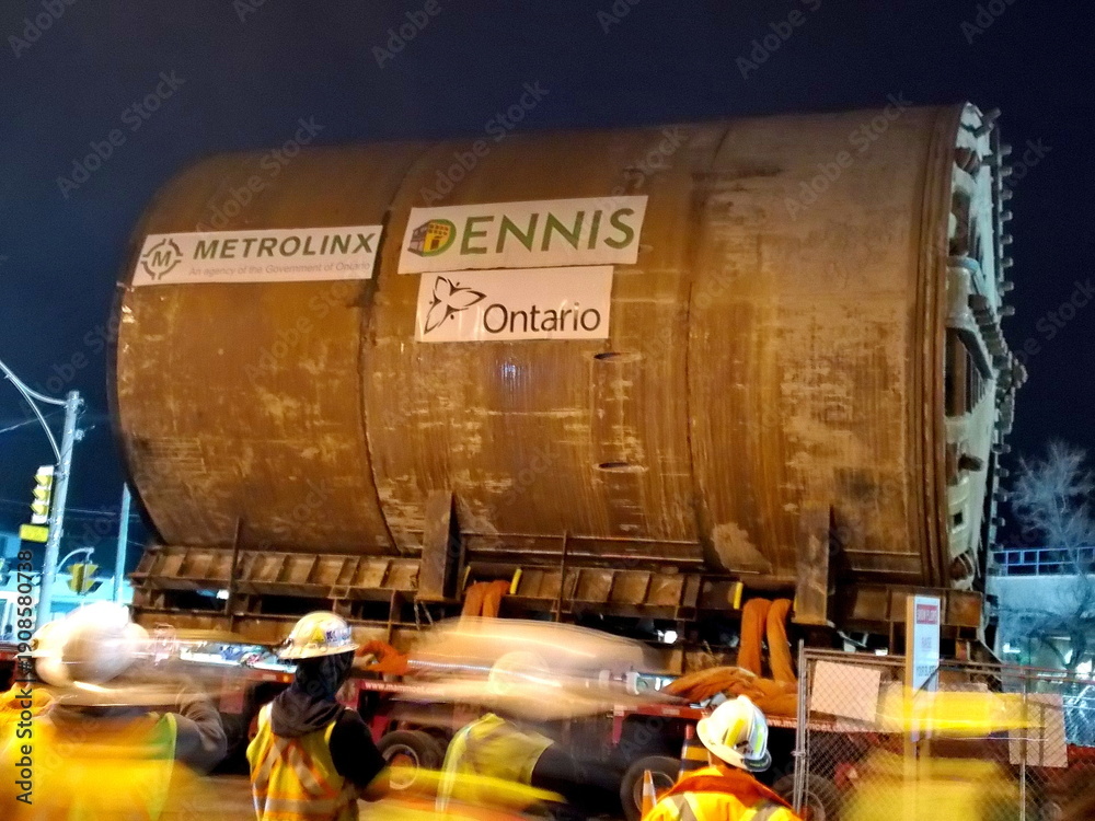 Fototapeta premium Toronto, Ontario, Canada, April 18, 2015: A tunnel boring machine is extracted west of Allen Road and moved on a massive trailer to be re-inserted east to bypass the TTC's Line 1 subway. This boring m