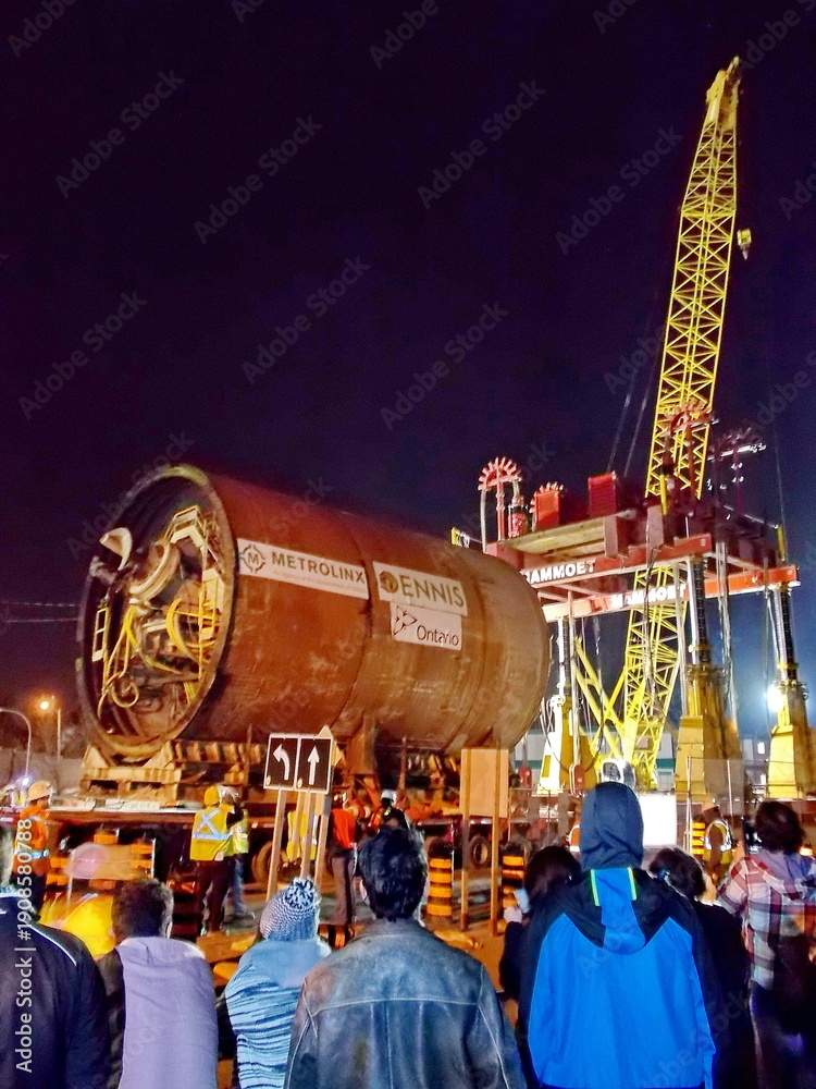 Fototapeta premium Toronto, Ontario, Canada, April 18, 2015: A tunnel boring machine is extracted west of Allen Road and moved on a massive trailer to be re-inserted east to bypass the TTC's Line 1 subway. This boring m