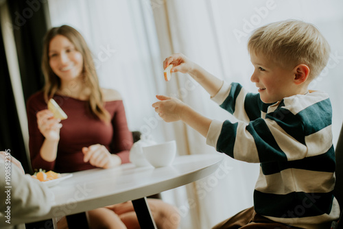 Child enjoys snack with par...