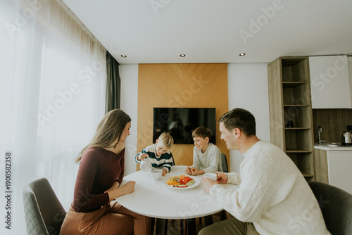 Family enjoys breakfast tog...