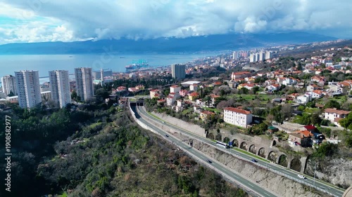 Aerial view of the Rjecina Viaduct, a modern highway spanning a rugged valley in Croatia. Engineering marvel amidst natural beauty.