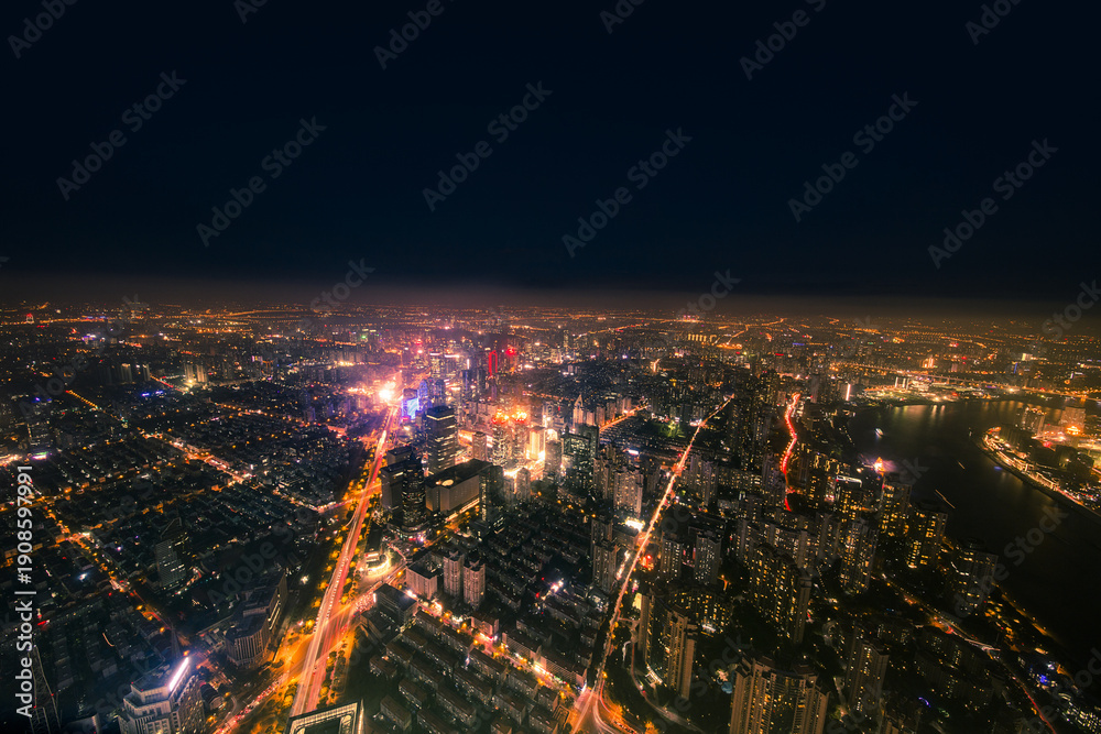 Fototapeta premium City Skyline Overlooking the Night - Aerial Urban Lights