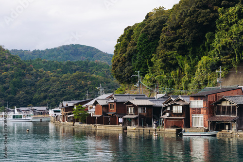 Ine Fishing Village, Kyoto prefecture, Japan, Ine-ura landscape coastal view, Funaya, traditional wooden boat houses, Ine Bay during boat tour cruise, Yoza District, in a autumn fall day