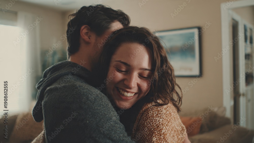 Obraz premium Couple embracing indoors with joy