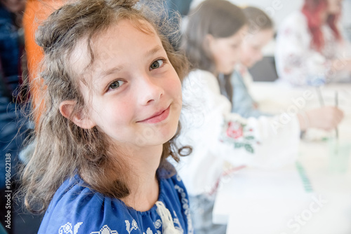 Foto Portrait of a Happy Smiling Girl Wearing Traditional Blue Embroidered Dress in C