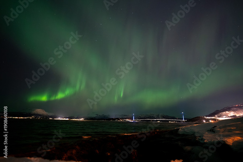 Aurora Borealis in the night sky above the Hålogaland Bridge near Narvik, Norway