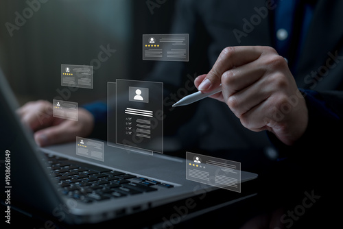 Fotografi Human resource evaluation concept with digital employee profiles and rating cards above laptop, showing performance assessment, candidate review, talent management and data driven HR decision making