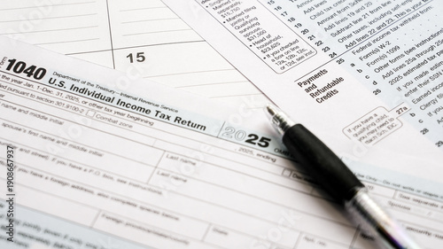 Obraz na płótnie Federal income tax return form 1040 document for the 2025 tax year with a pen, r