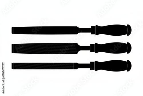 Essential Files: A set of essential files, their silhouettes sharply defined against a clean backdrop, showcasing precision tools of craftsmanship