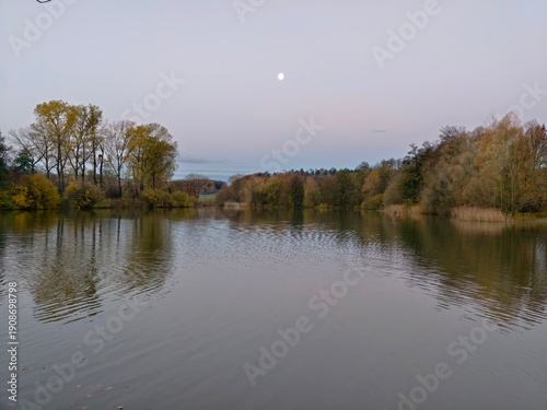 Quadro su tela calm waters under pastel sky, tranquil landscape featuring moonrise and gentle s