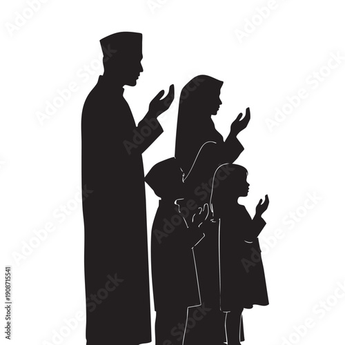 A family in silhouette praying together