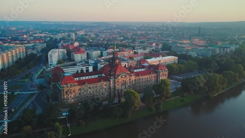 At dawn, the aerial camera pans from left to right, circling around Dresden's former Joint Ministerial Building of the Royal Saxon Ministries along the Laube river 
