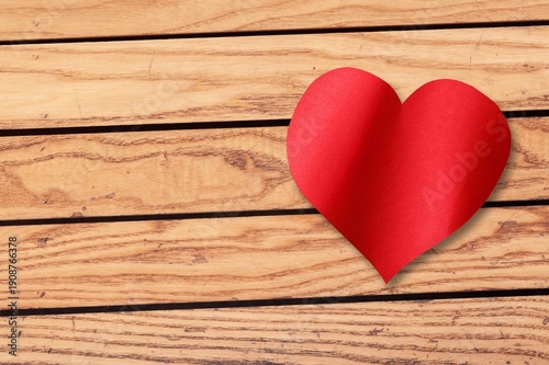 Beautiful red heart on a desk for love concept