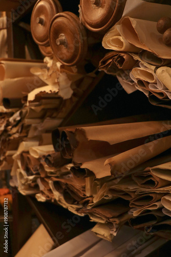 Fotografie Old data sourse Rolled up stacks of unbound thick scrolls of ancient manuscripts
