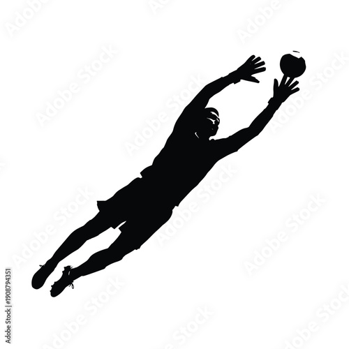 A silhouette of a man jumping to catch a ball in mid-air