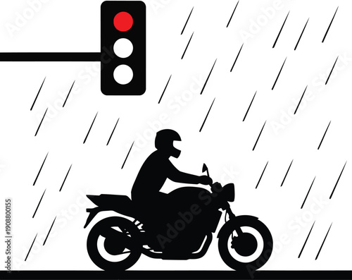 Silhouette of a Motorcyclist Stopped at a Red Traffic Light in the Rain