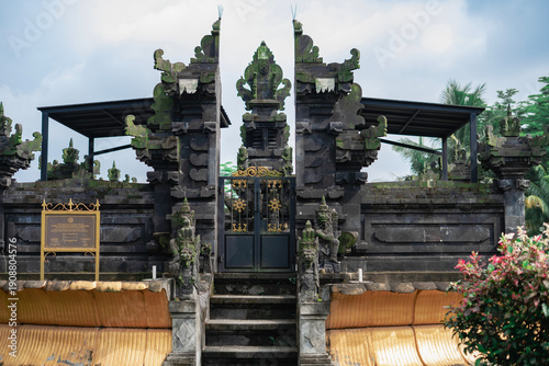 Detailed Balinese Guardian Statue at Traditional Hindu Temple Gate