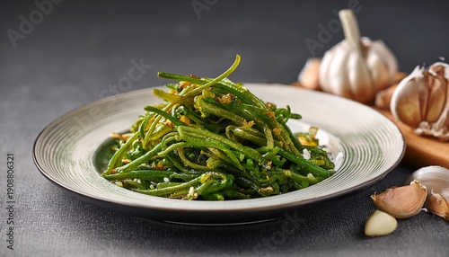 Fried Green Salty Crisp Samphire Or Salicornia Plants With Garlic On Plate On Grey Background Close Up