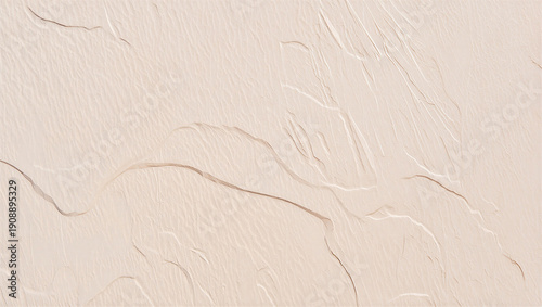 Pale pink textured sand dunes with wind patterns, abstract natural background