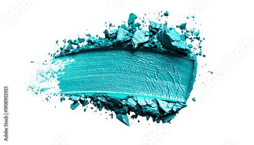 A close-up of vibrant turquoise eyeshadow swatch with fragmented powder on black background