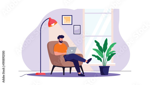 Relaxed man working remotely on a laptop while sitting in a cozy armchair in his living room during the evening.