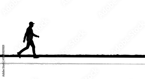 Silhouette of a man walking against a bright white background.