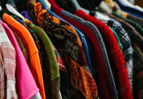 Konstfotografi Thrifted vintage shirts of many colors and patterns on a clothing rack in a shop