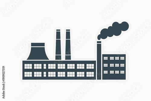 factory building with smokestacks emitting smoke