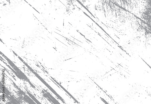 Grey distressed texture with diagonal scratches and speckles on white background. Grunge overlay effect