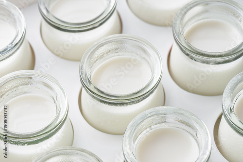 Wallpaper Mural Closeup view of small jars with freshly prepared homemade yogurt Torontodigital.ca