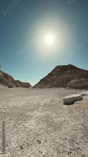 Panoramic 180 view from driving car in desert valley with limestone cliffs and eroded sandy ground