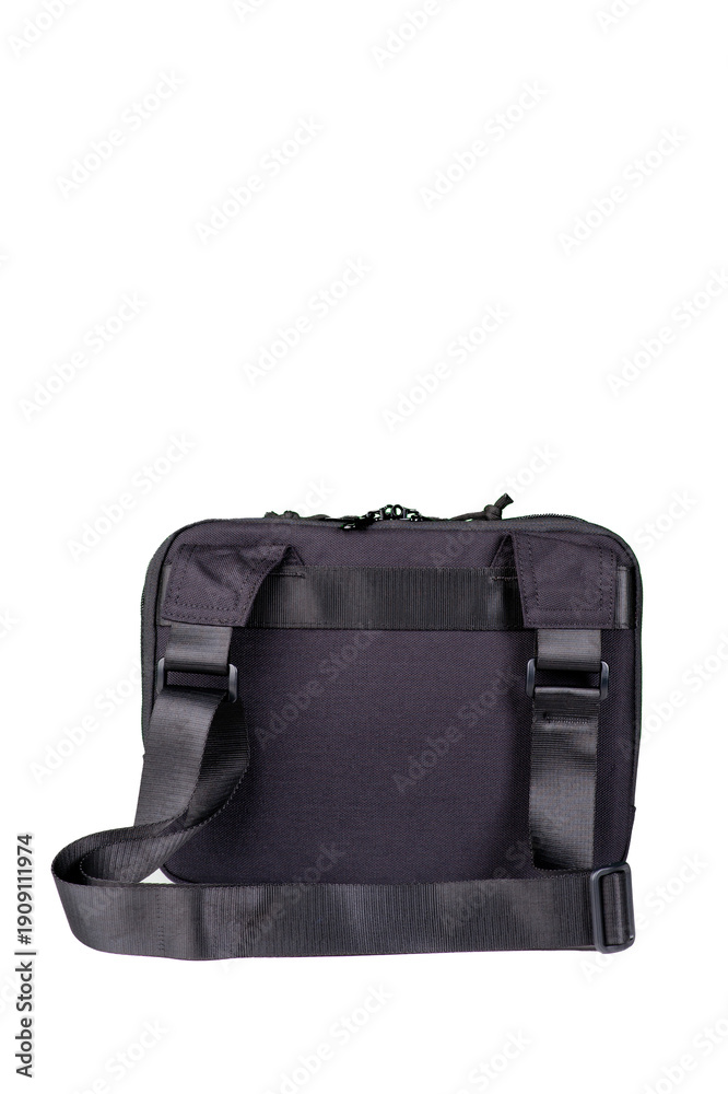 Naklejka premium A small black bag with a long adjustable handle.