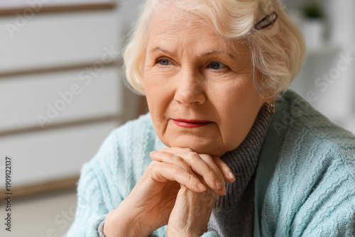 Thoughtful senior woman at ...