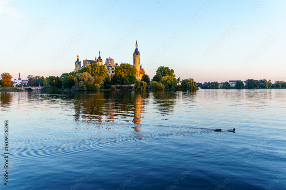 Fototapeta premium Sunrise view of the lake and the Schwerin Castle