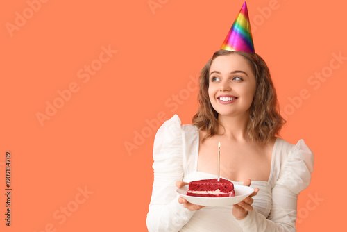 Young woman in party hat wi...