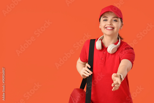 Female courier with food ba...