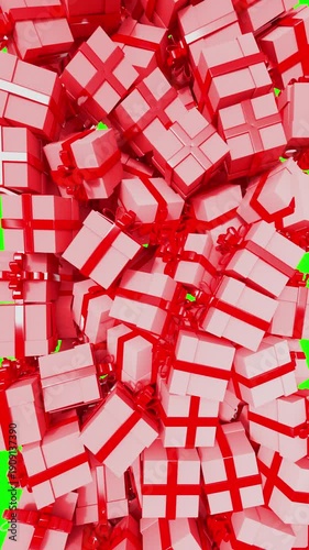 Red gift boxes 3d falling on green screen.