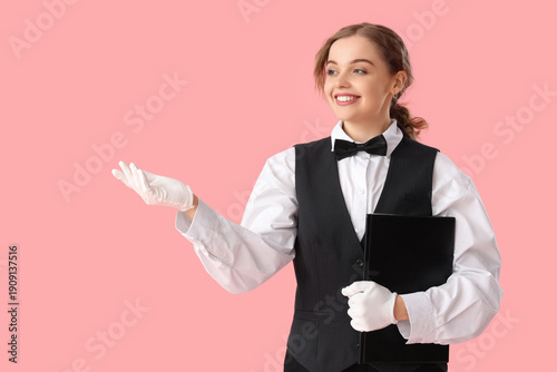 Young waitress with menu on...