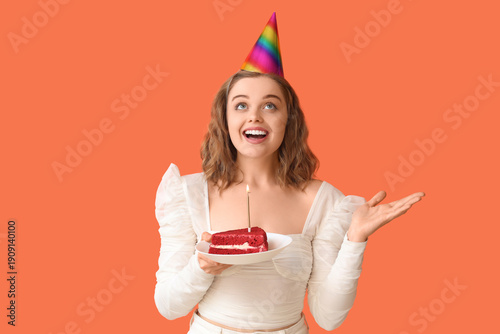 Young woman in party hat wi...