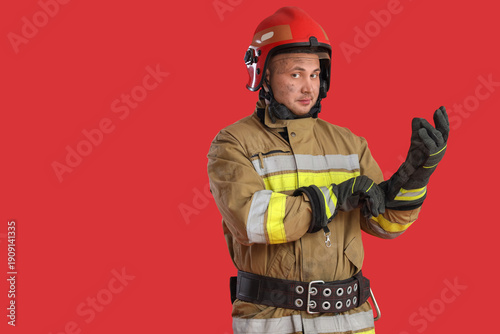 Male firefighter putting gl...