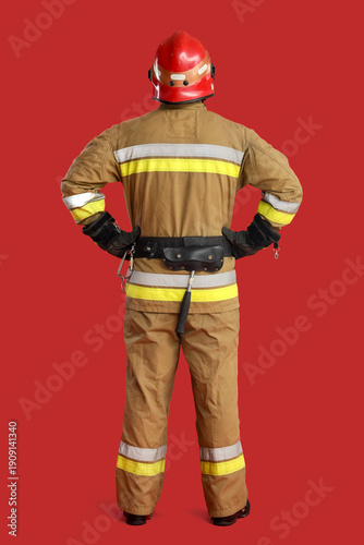 Male firefighter on red bac...