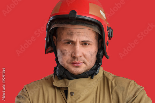 Male firefighter on red bac...
