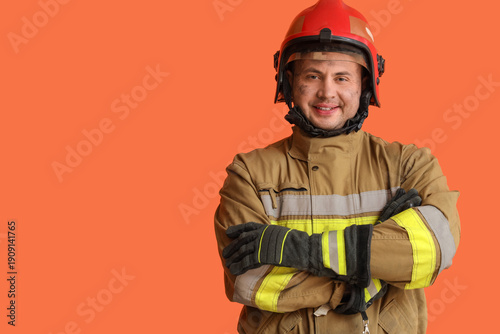 Male firefighter on orange ...
