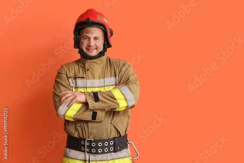 Male firefighter on orange ...