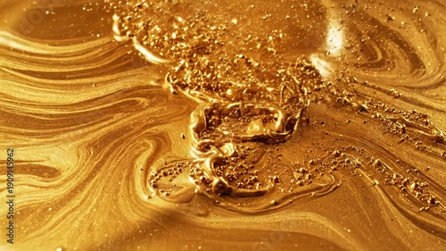 Fluid gold swirls with shimmering particles and iridescent textures