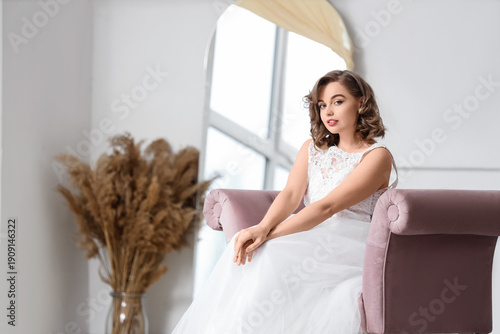 Beautiful bride sitting on ...