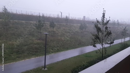 Heavy Rain and Mist Over Residential Pedestrian Path in Regensburg